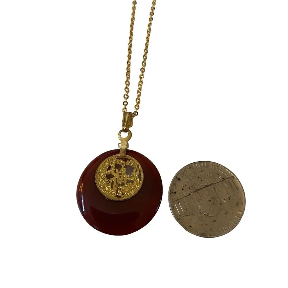 Delicate Looking Vintage Pendant on Shimmering Gold Tone Chain.